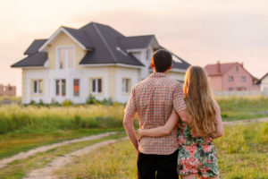 Couple Looking at Their New House | One80Law Group