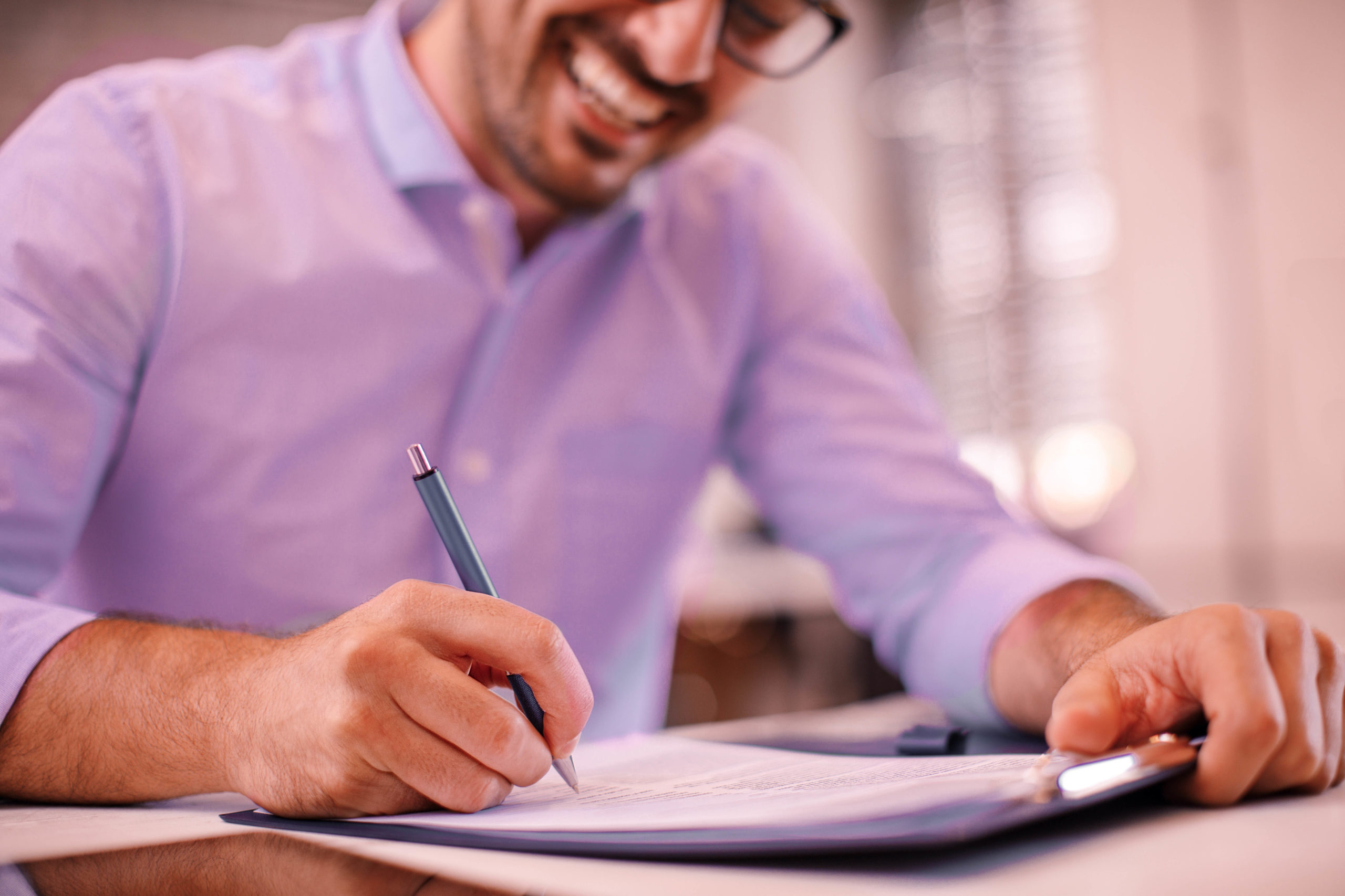 Young Businessman Signing a Contract | Business Lawyer | One80Law Group